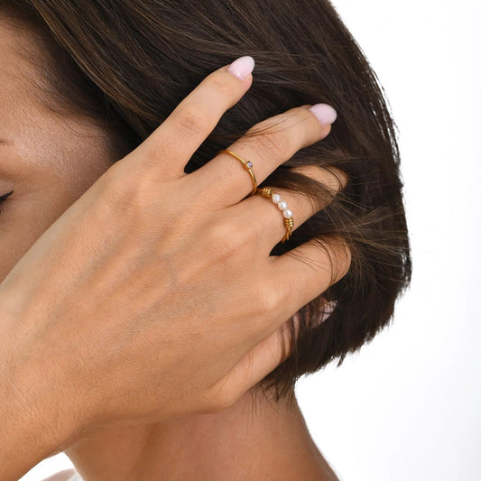Bague torsadée avec perle